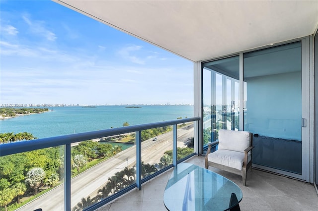 balcony featuring a water view