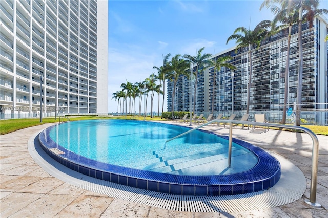 view of swimming pool featuring a patio area