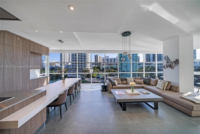 living room featuring expansive windows and plenty of natural light