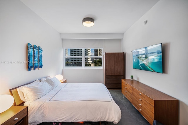 bedroom featuring dark tile patterned flooring