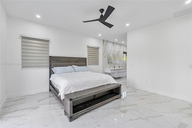 bedroom with ceiling fan and ensuite bath