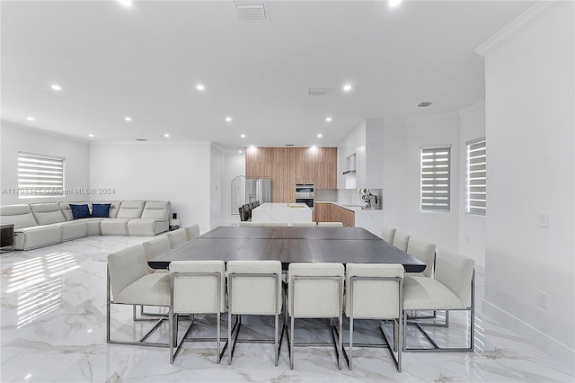 dining room with ornamental molding