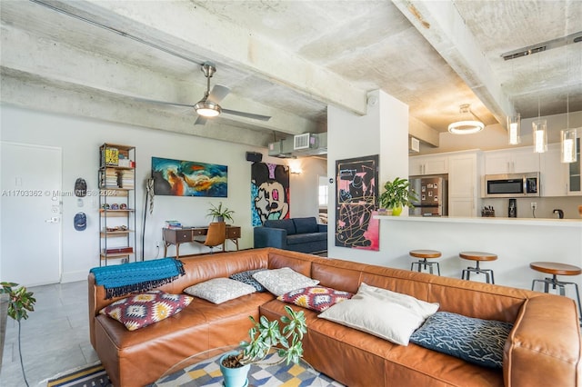 living room featuring ceiling fan and beam ceiling