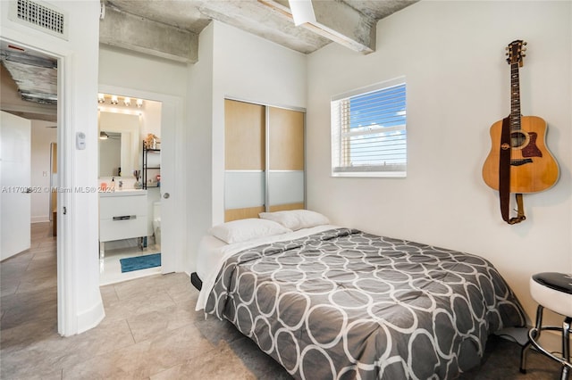 bedroom featuring a closet and light tile patterned floors