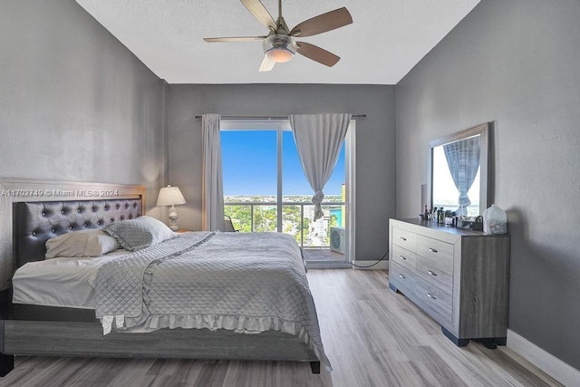 bedroom featuring light hardwood / wood-style floors and ceiling fan