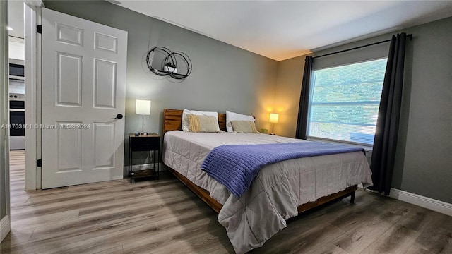 bedroom featuring dark hardwood / wood-style flooring