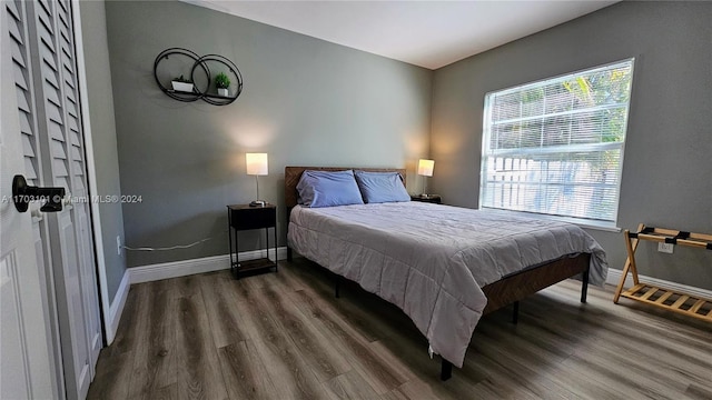 bedroom featuring dark wood-type flooring