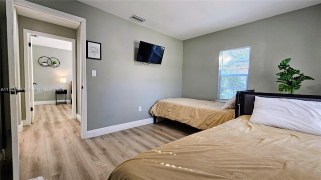 bedroom featuring light hardwood / wood-style floors