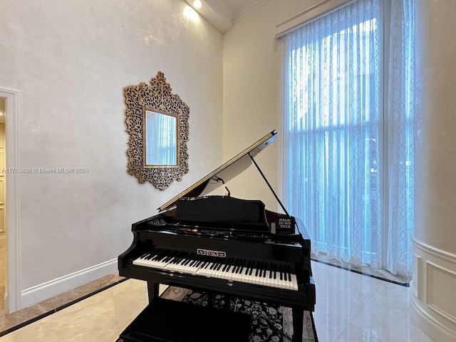 miscellaneous room with ornamental molding and light tile patterned flooring