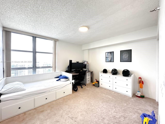 carpeted bedroom with a textured ceiling