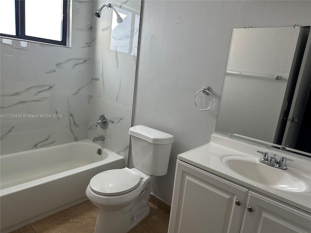 full bathroom with vanity, toilet, and tiled shower / bath