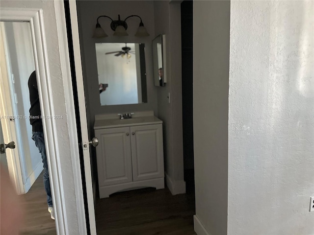 corridor featuring dark hardwood / wood-style floors and sink