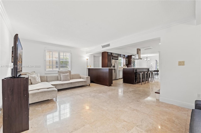 living area featuring visible vents, crown molding, and baseboards