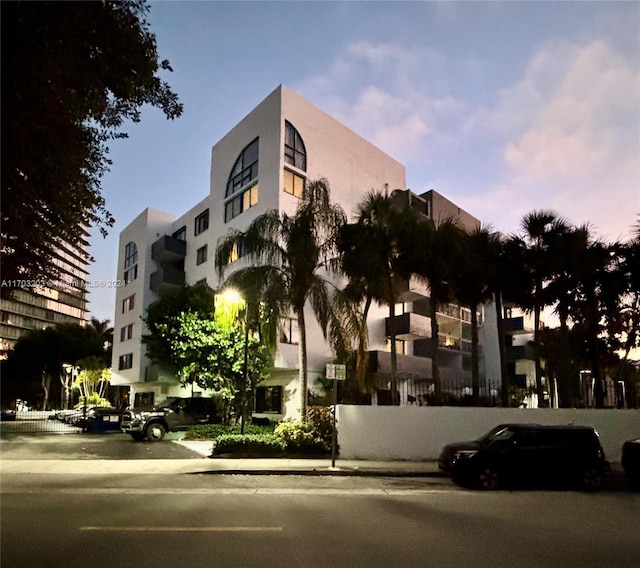 view of outdoor building at dusk