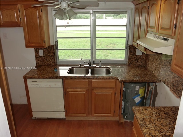 kitchen with white dishwasher, sink, hardwood / wood-style flooring, ceiling fan, and extractor fan