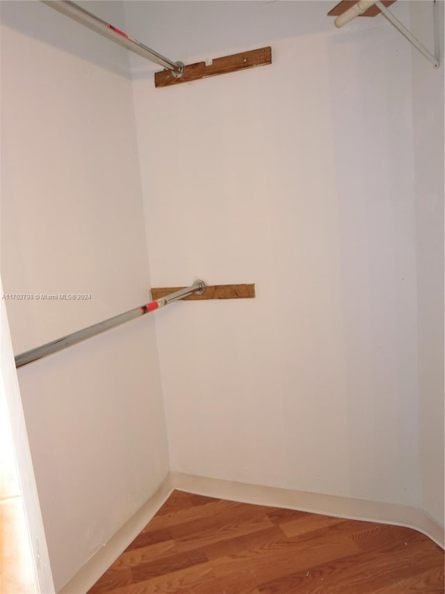 walk in closet featuring wood-type flooring