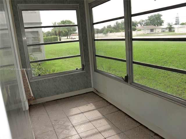 unfurnished sunroom featuring a wealth of natural light