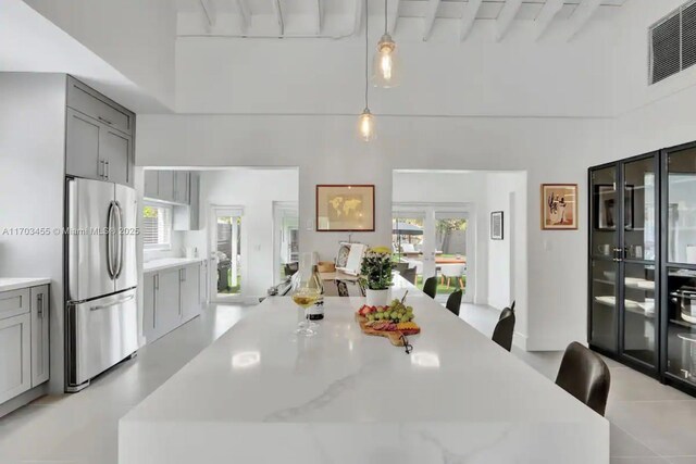 bedroom with rail lighting and light hardwood / wood-style flooring