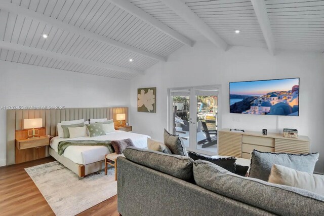 bedroom with access to exterior, lofted ceiling with beams, french doors, and wood-type flooring