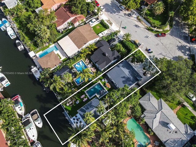 birds eye view of property featuring a water view