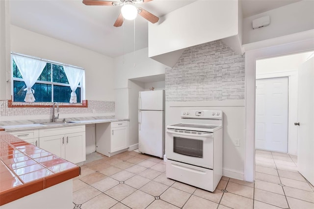 kitchen featuring tile countertops, white appliances, backsplash, white cabinets, and sink