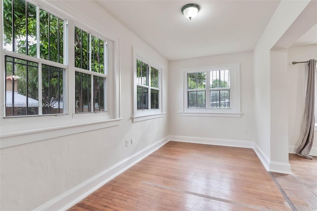 empty room featuring light hardwood / wood-style floors and a wealth of natural light