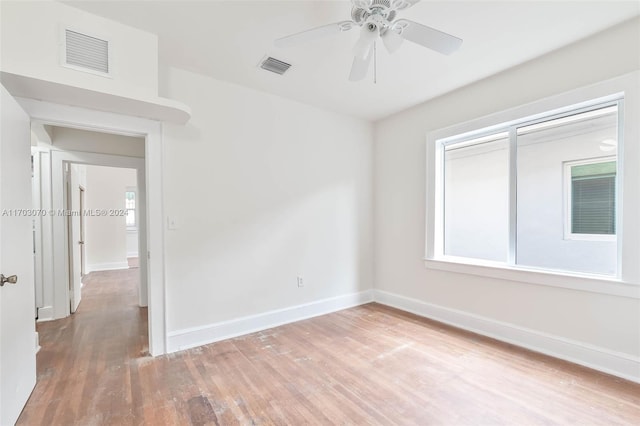 unfurnished room featuring ceiling fan and light hardwood / wood-style floors