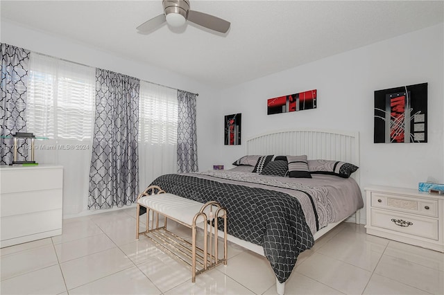 tiled bedroom with ceiling fan