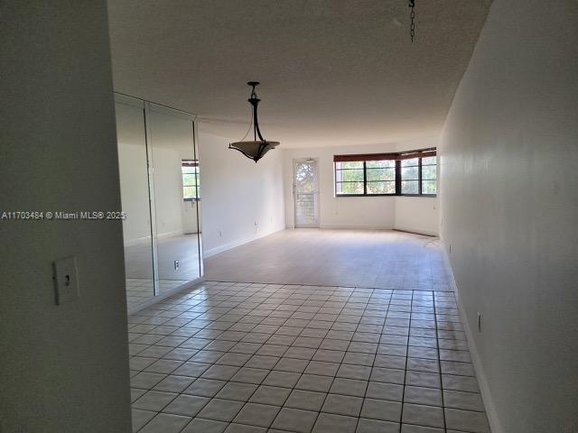 view of tiled spare room