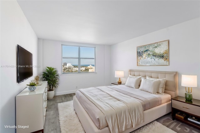 bedroom with hardwood / wood-style floors