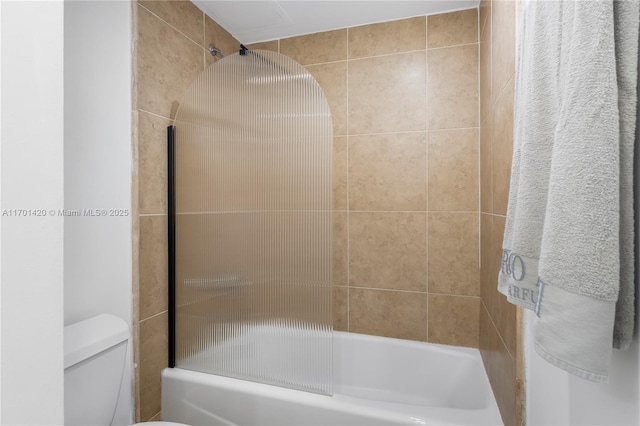 bathroom featuring toilet and shower / bathing tub combination