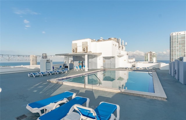 view of pool featuring a water view