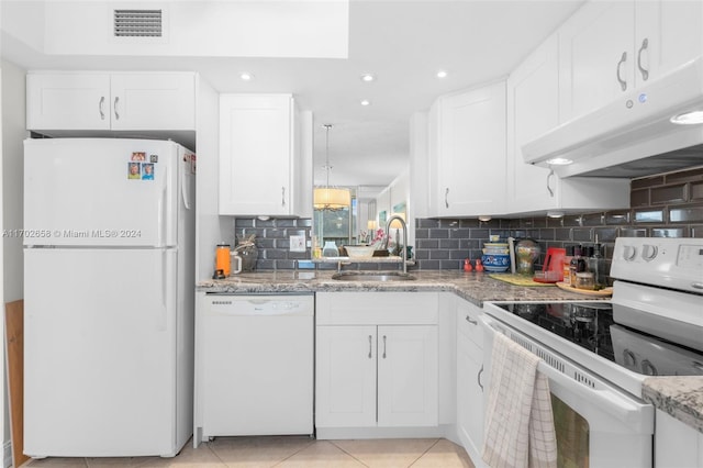 kitchen featuring white appliances, backsplash, white cabinets, sink, and light tile patterned floors