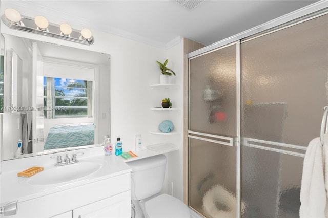 bathroom with toilet, a shower with door, vanity, and ornamental molding