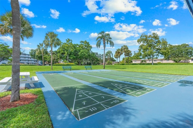 view of community featuring a yard