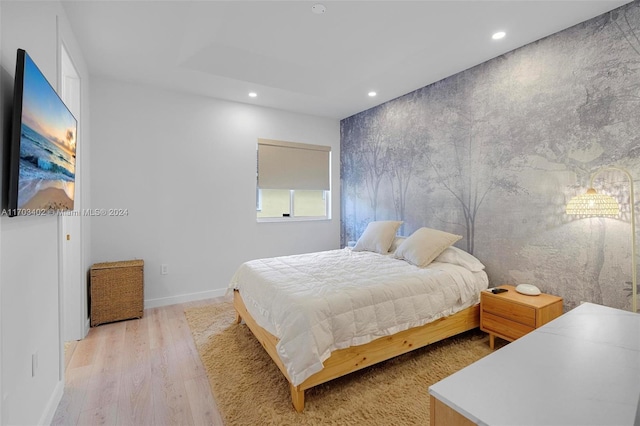 bedroom with light wood-type flooring