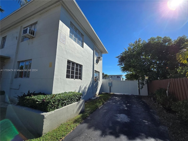 660 84th St Unit 39, Miami Beach, FL 33141 - view of side of home featuring asphalt driveway