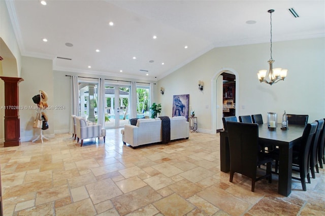 dining room featuring an inviting chandelier, crown molding, and french doors