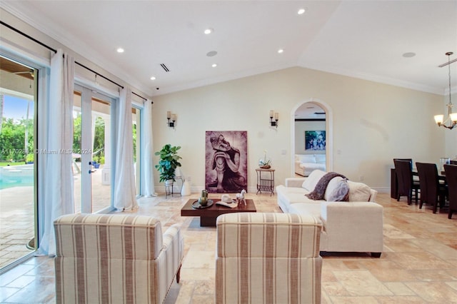 living room featuring lofted ceiling, an inviting chandelier, and ornamental molding