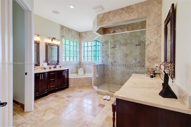 bathroom with plus walk in shower and vanity