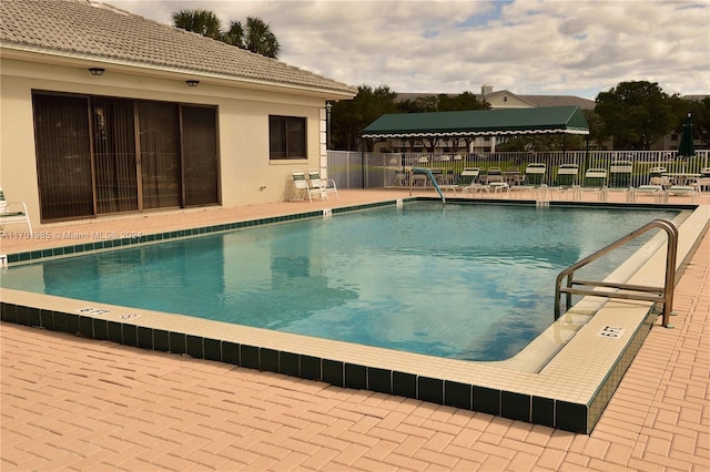 view of swimming pool featuring a patio