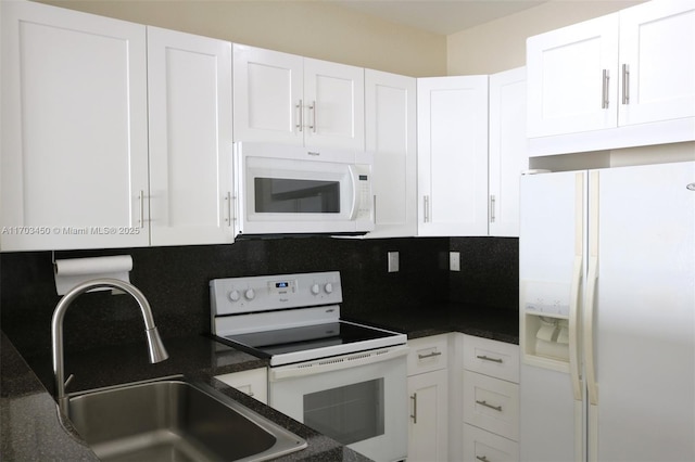 kitchen with white cabinets, white appliances, sink, and tasteful backsplash