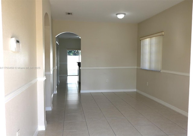 unfurnished room featuring tile patterned floors