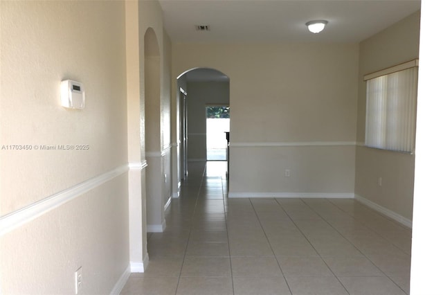 corridor with tile patterned flooring