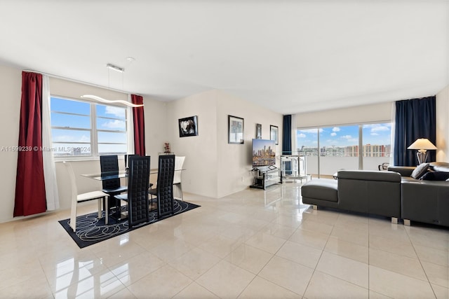 living room with a healthy amount of sunlight and light tile patterned flooring