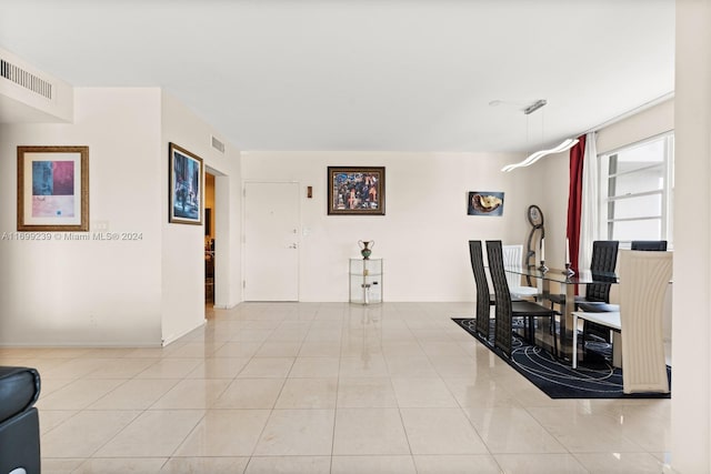 dining area with light tile patterned floors