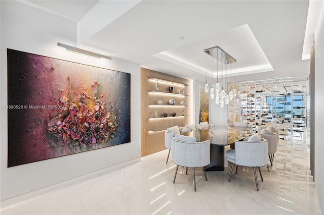 dining room featuring a tray ceiling