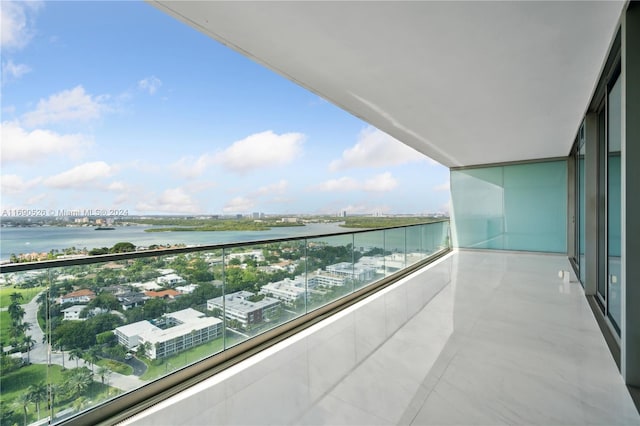 balcony featuring a water view