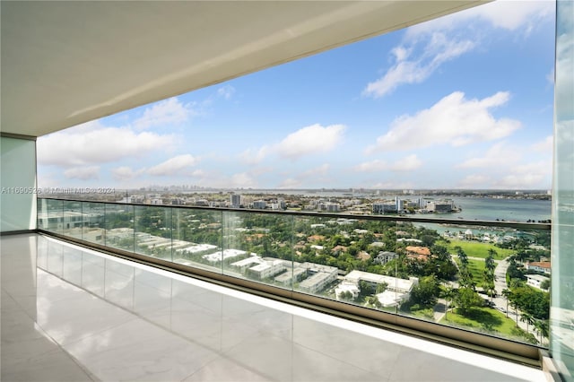 balcony featuring a water view