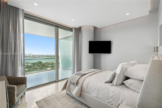 bedroom featuring access to exterior and expansive windows